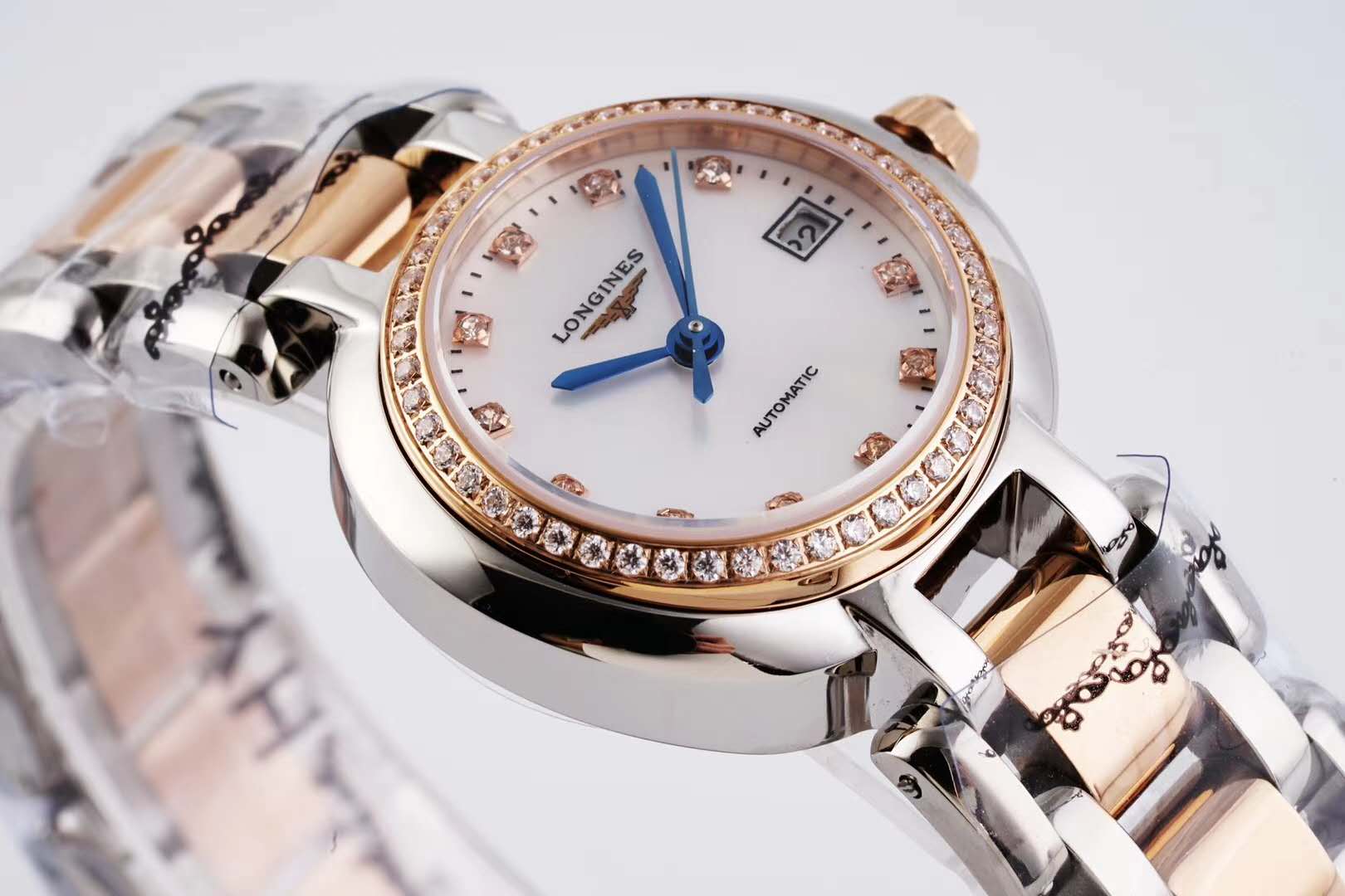 primaluna mop white dial with Di*m*nd markers and Di*m*nd bezel in rose gold